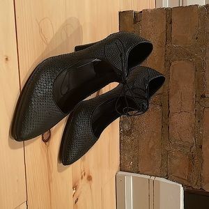 black lace up heels. 3 inches high. Never worn.